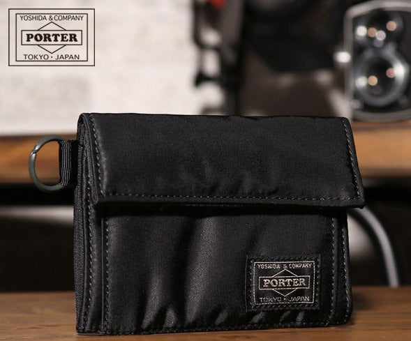 Black Porter Yoshida Japan Tanker Two-Fold Wallet with multiple card slots and sleek leather design.