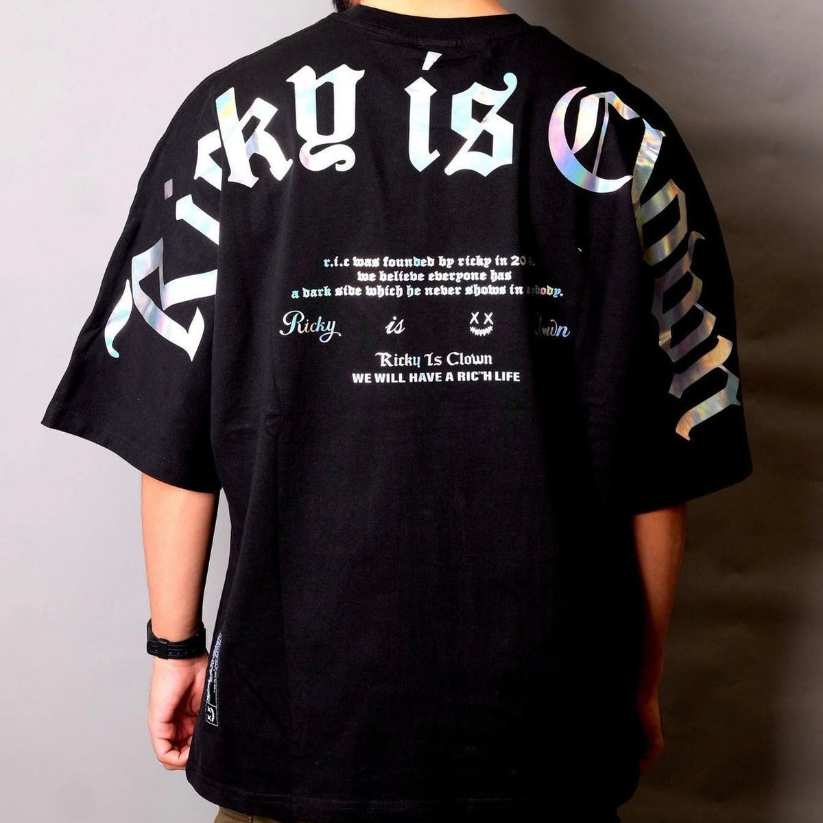 Rickyisclown holographic gothic drop shoulder black T-shirt with drop shoulder design and reflective holographic details.