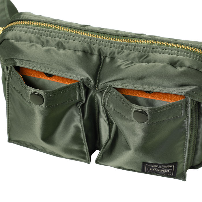 Porter Yoshida Japan Tanker waist bag in sage green with multiple compartments and adjustable strap, made by PORTER JAPAN.