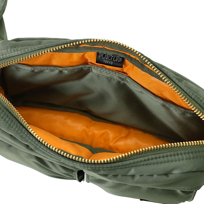 Porter Yoshida Japan Tanker waist bag in sage green with multiple compartments, durable fabric, and adjustable strap.
