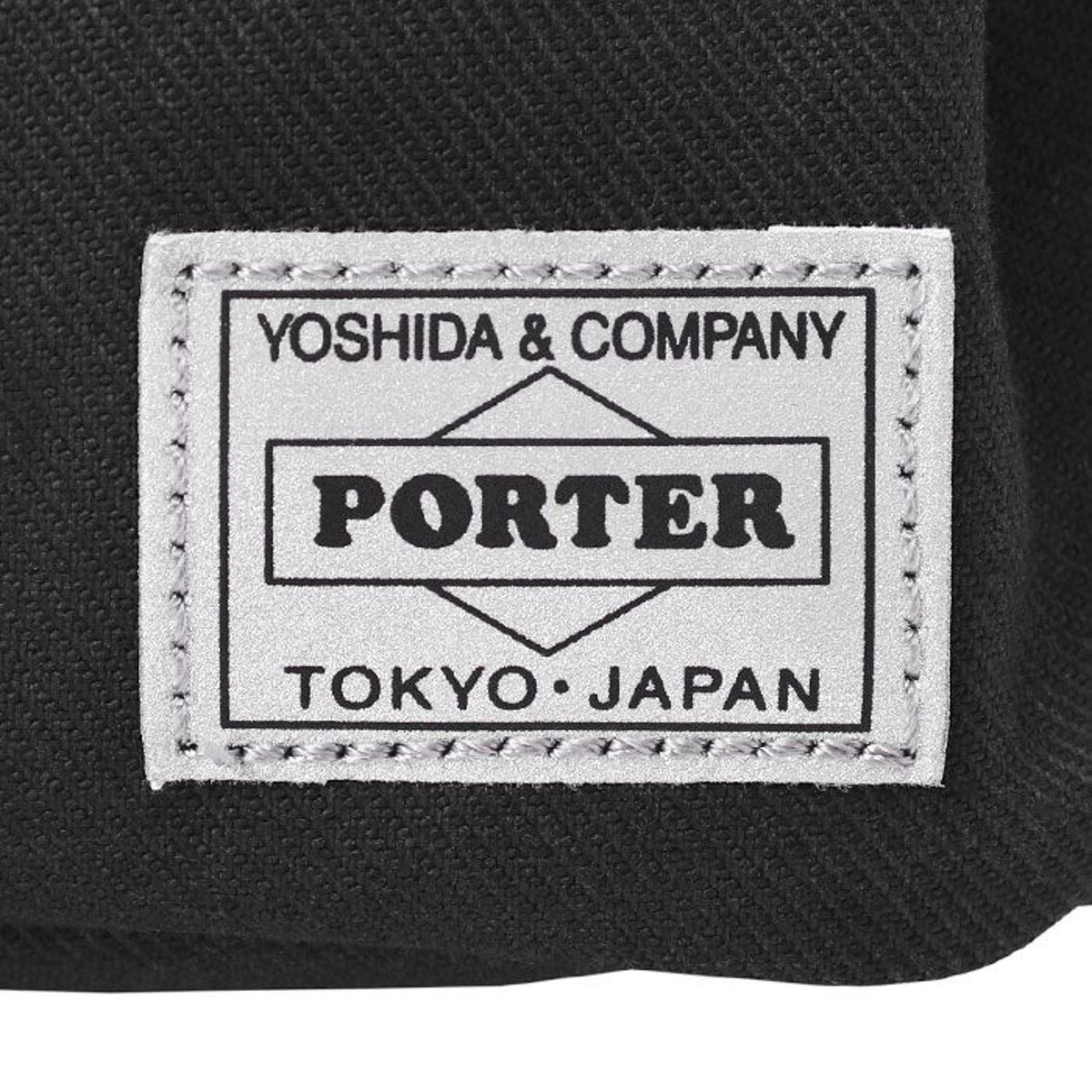 Porter Yoshida Japan Switch waist bag in black with adjustable strap and zippered compartments, stylish and practical accessory.