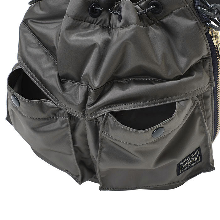 Black Porter Yoshida Japan Tanker 2-Way Tool Bag with multiple compartments and sturdy handles for versatile carrying.