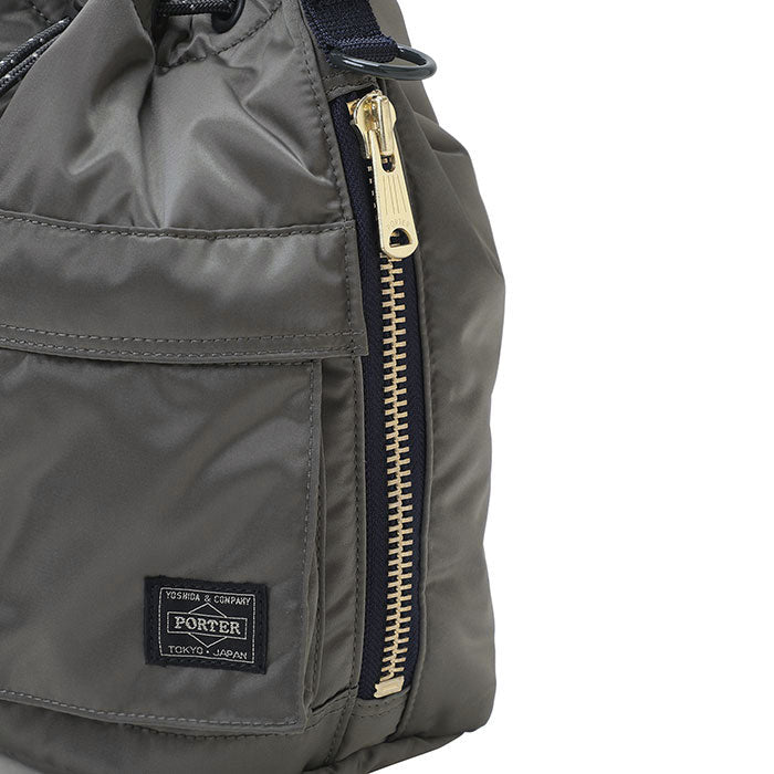 Black Porter Yoshida Japan Tanker 2-Way Tool Bag with multiple compartments, durable fabric, and sturdy handles for versatile use.