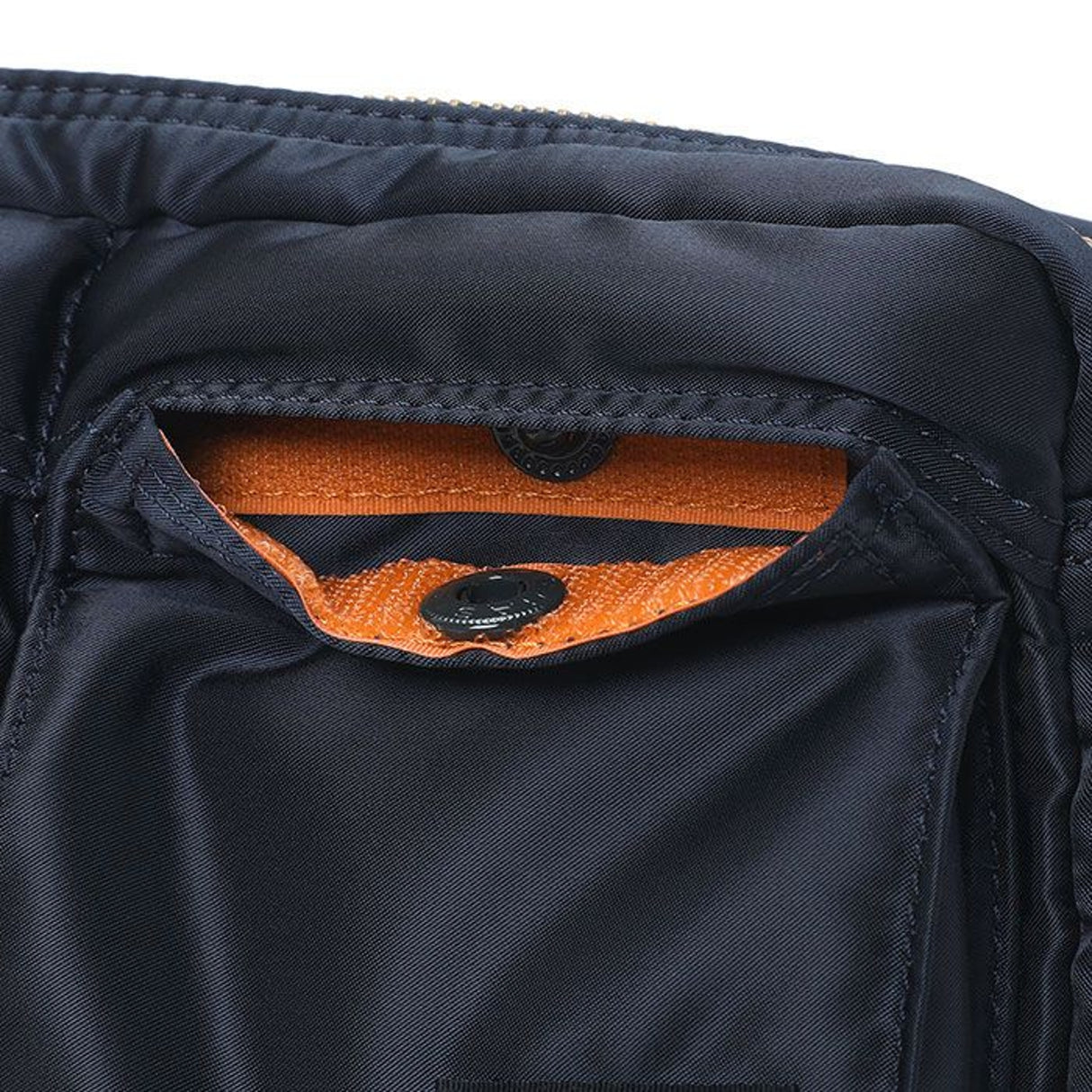 Porter Yoshida Japan Tanker Waist Bag in iron blue, featuring adjustable strap and multiple compartments for everyday use.