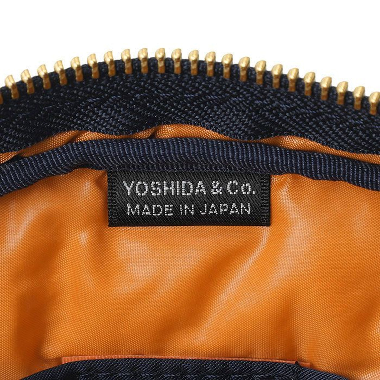 Porter Yoshida Japan Tanker Waist Bag in iron blue with multiple compartments, made of durable fabric, stylish and functional.