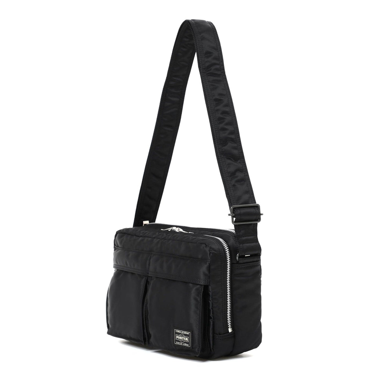 Black Porter Yoshida Japan Tanker Sling Bag with adjustable strap and compact design, made of durable material.