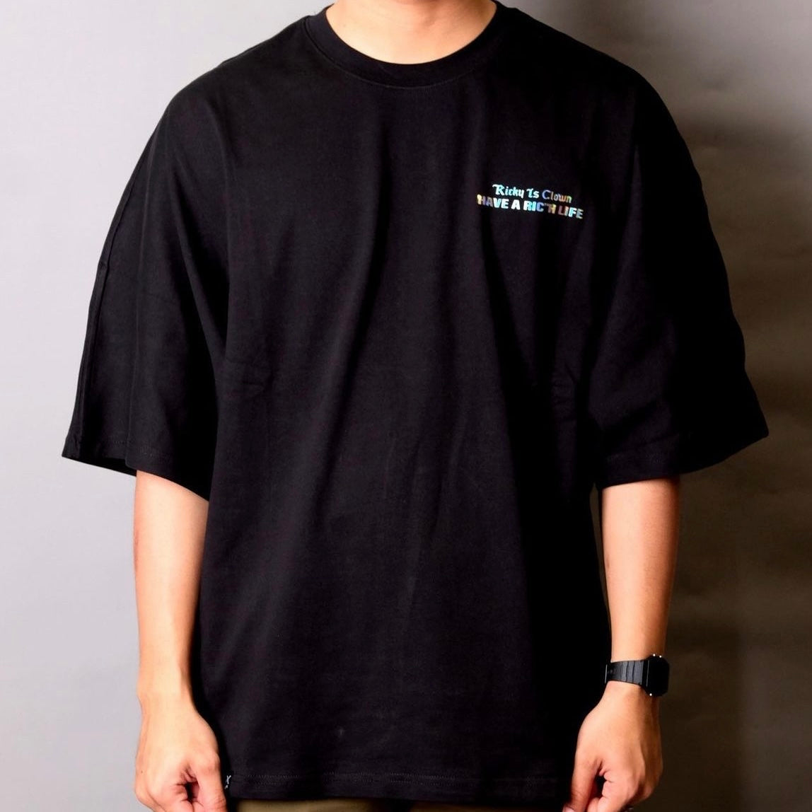 RICKYISCLOWN holographic gothic drop shoulder black tee shirt with drop shoulder design and reflective holographic print.