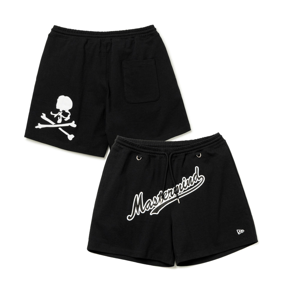 Black Mastermind Japan X New Era script logo shorts, casual apparel with the iconic branding and comfortable fit, shown on a flat surface.