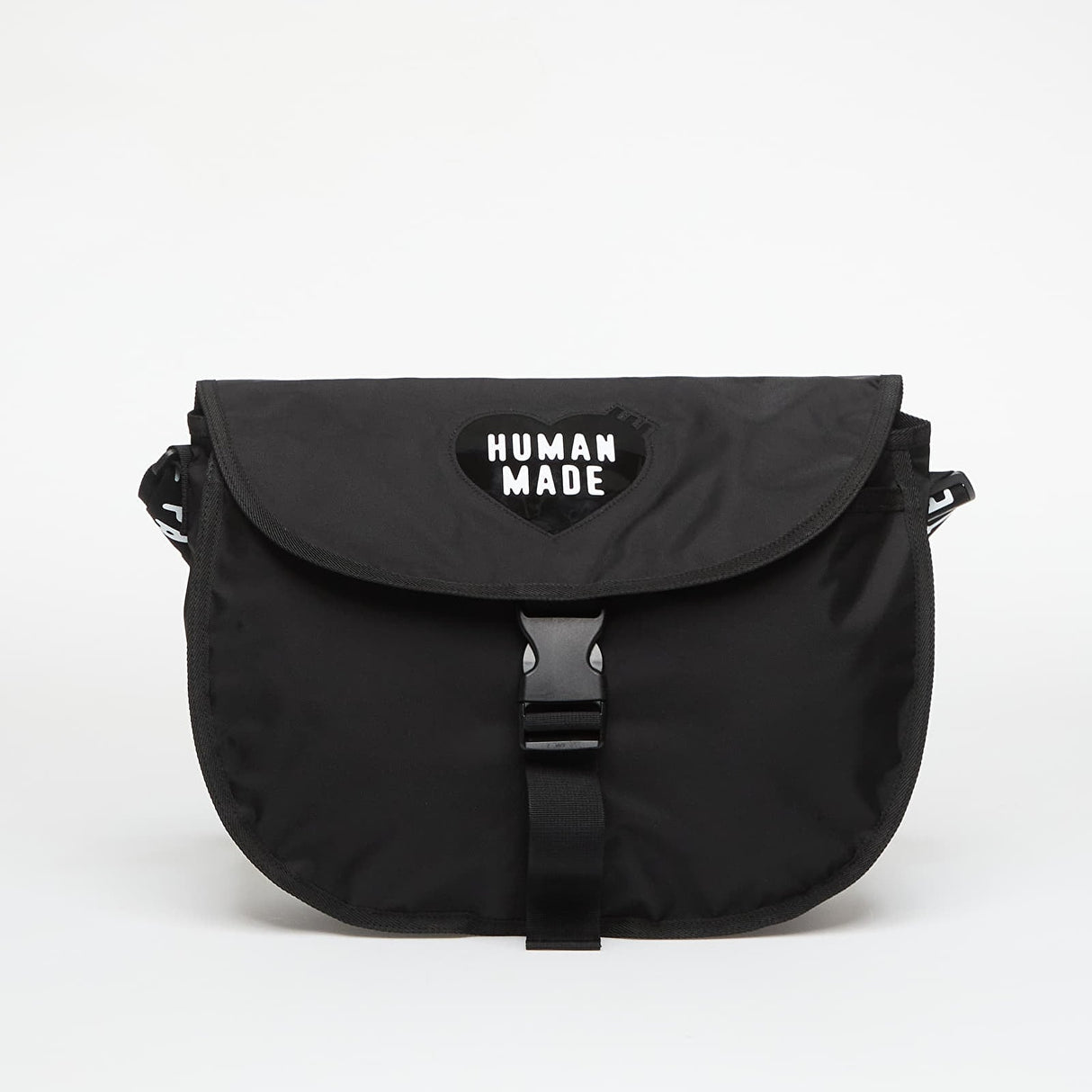 Black Human Made shoulder bag with adjustable strap and spacious interior, showcasing a stylish and functional accessory.