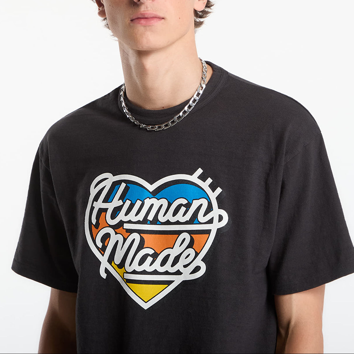 Black Human Made Tri-Color Heart Logo T-shirt featuring a colorful heart graphic on the front, casual and stylish apparel.