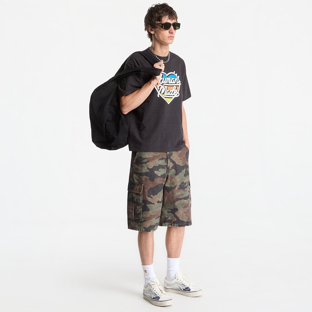 Black Human Made Tri-Color Heart Logo T-shirt with colorful heart graphic on the front, casual streetwear apparel.