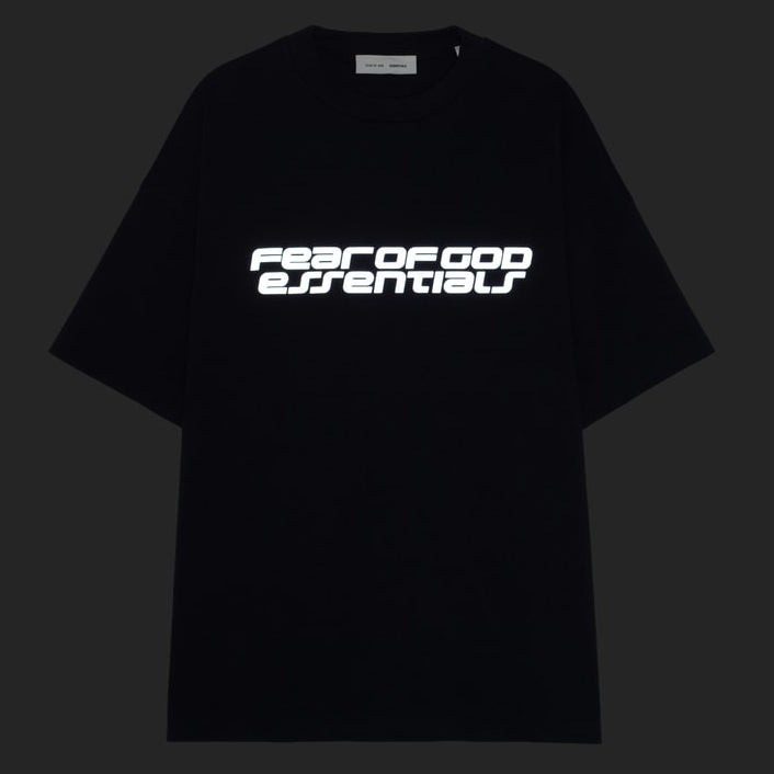 Fear of God Essentials black Reflective Logo 90s T-shirt featuring a reflective logo design on the front.