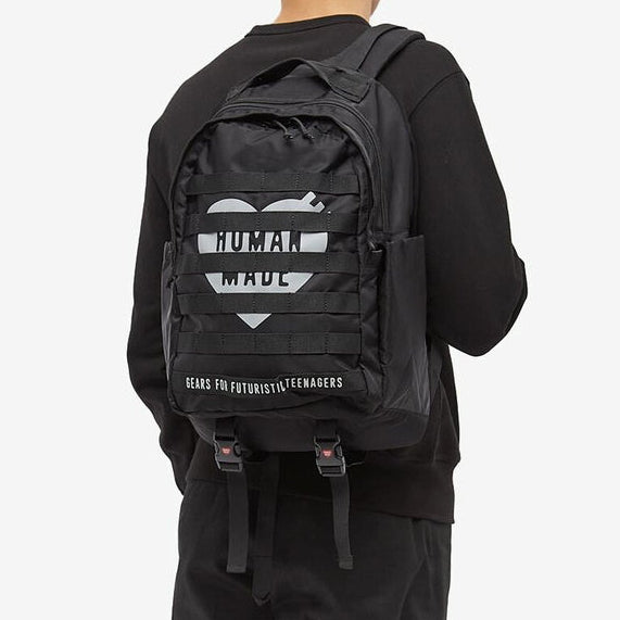 Black Human Made Military Backpack with multiple compartments, adjustable straps, and durable fabric for outdoor and urban use.