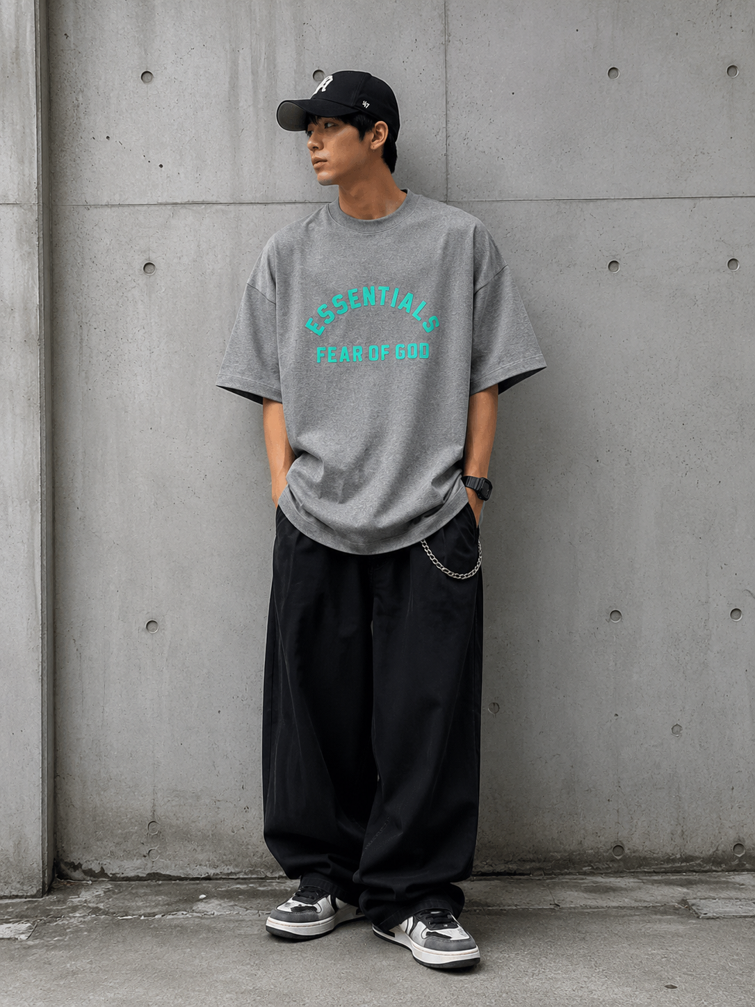 Fear of God Essentials heavyweight dark heather T-shirt, casual apparel with a relaxed fit, soft fabric, and minimal branding.