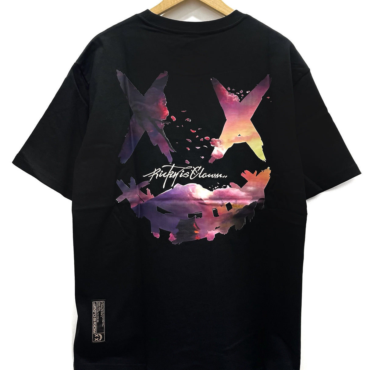 RICKYISCLOWN Sakura Sunset Tee in black featuring a colorful sunset graphic on the front, casual apparel for streetwear style.
