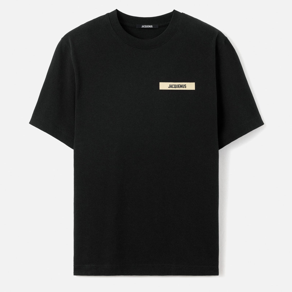 Black Jacquemus Grosgrain Logo Tee with visible logo detail, styled as a casual apparel piece from MASTERMIND JAPAN.