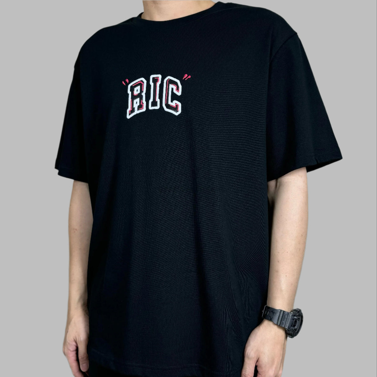 Black Rickyisclown Big Embossed Snake T-shirt, casual apparel with bold snake design, displayed on a plain background.