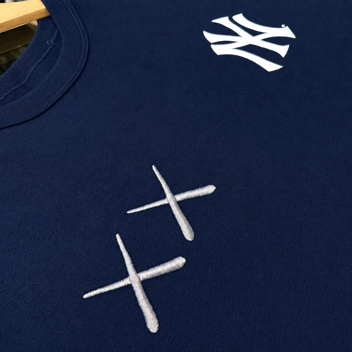 Human Made KAWS x Nike MLB Elevated Max 90 Navy men's tee, featuring graphic design and branding on soft cotton fabric.