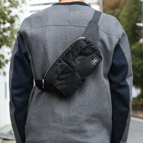 Black Porter Yoshida Japan Tanker Waist Bag with adjustable strap and multiple compartments, designed for convenient everyday use.