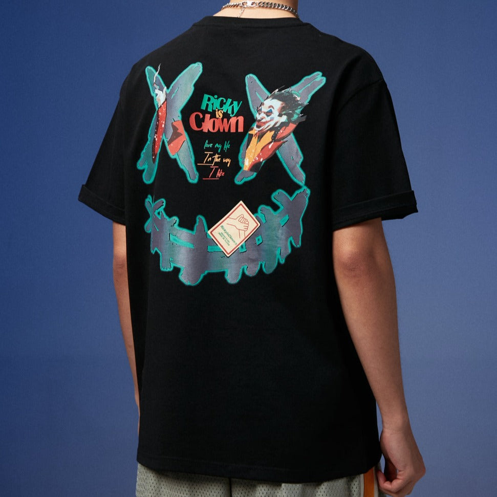 Black Rickyisclown Joker Laser Reflective Smiley Tee with colorful clown face print on front, casual men's apparel.