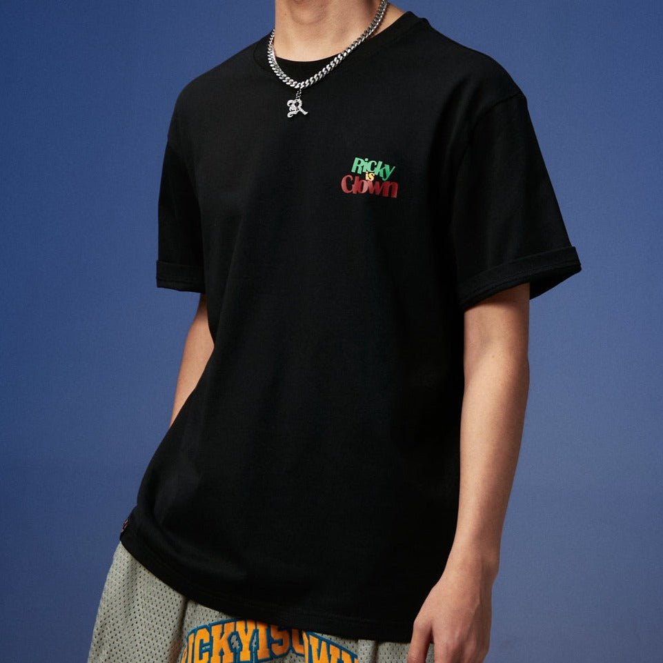 Black Rickyisclown Joker Laser Reflective Smiley Tee featuring a bold smiley graphic, casual fit, and reflective details.
