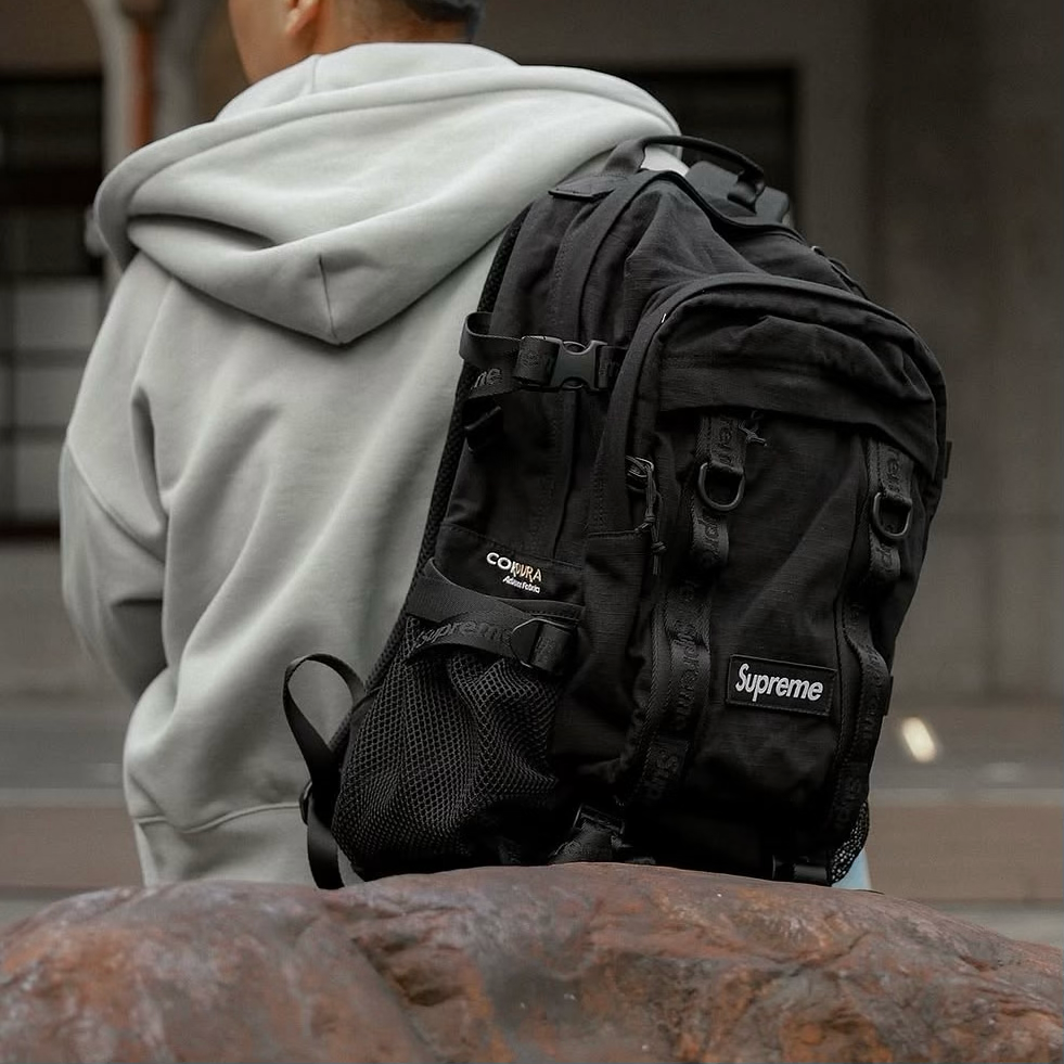 Supreme black box logo backpack with adjustable straps and front pocket, stylish and durable bags for everyday use.