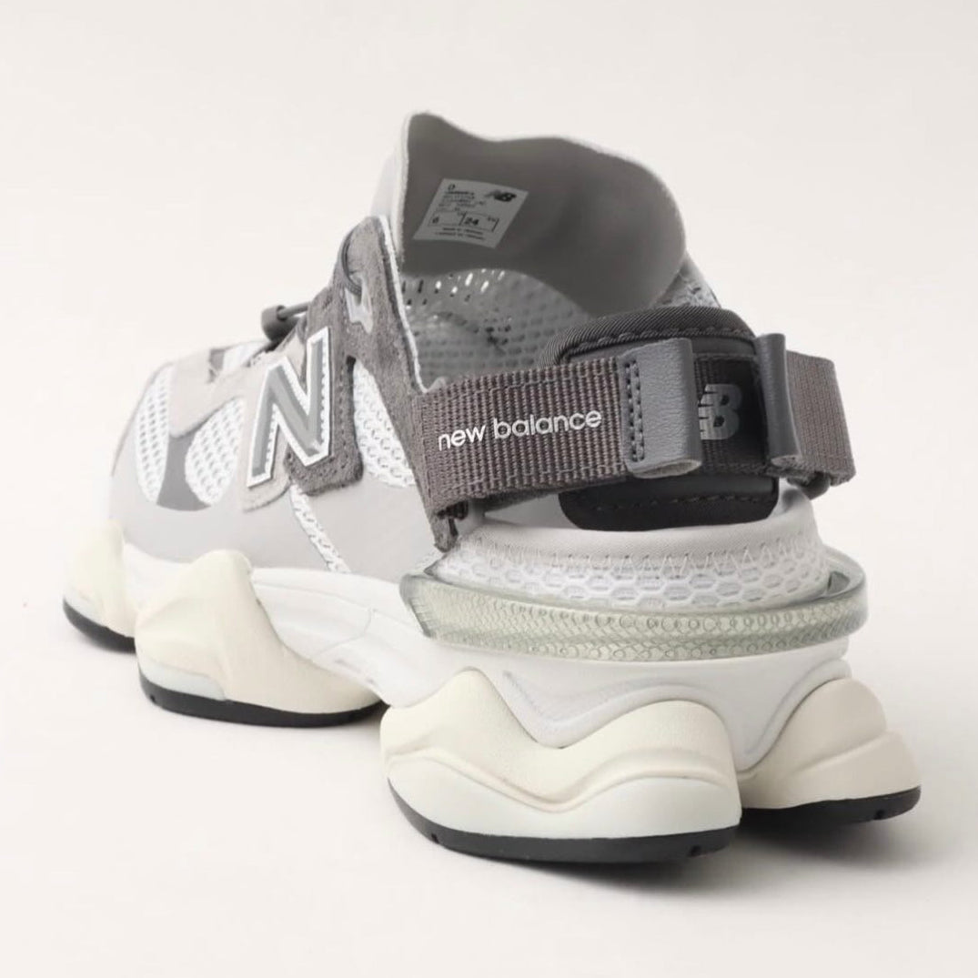 New Balance 9060 Mule Raincloud Castlerock sneakers showing the stylish gray design and textured details.