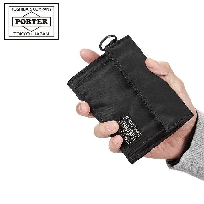 Black Porter Yoshida Japan Tanker Two-Fold Wallet with multiple card slots and bill compartments, made of durable fabric.