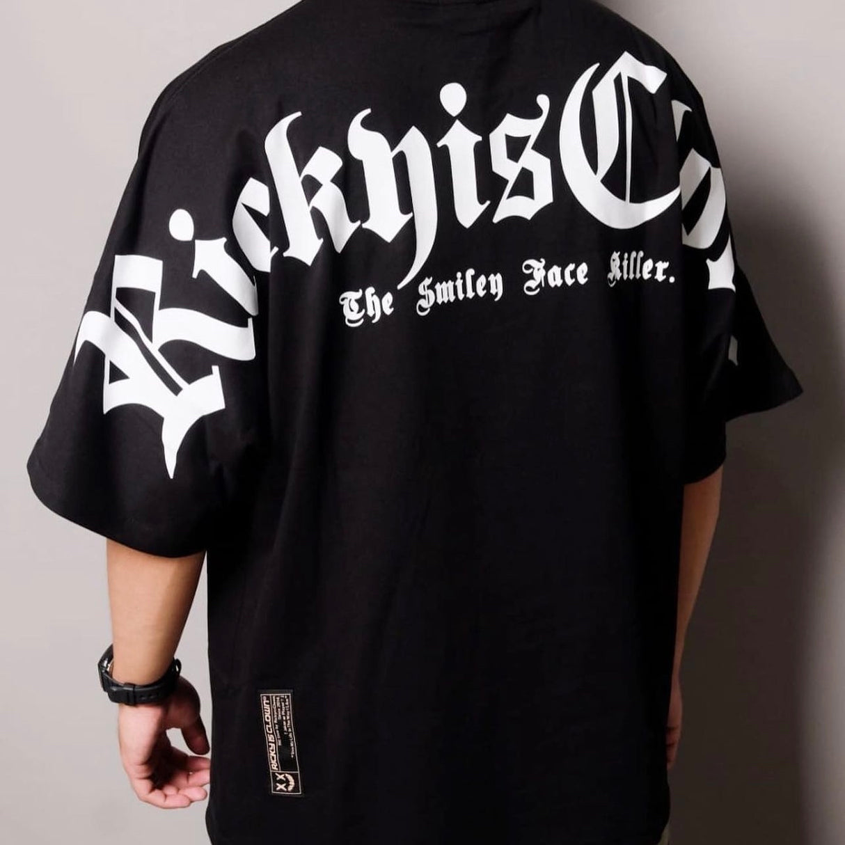 Black Rickyisclown Gothic Logo Drop Shoulder Tee showcasing a bold logo design on the front, casual and stylish apparel.