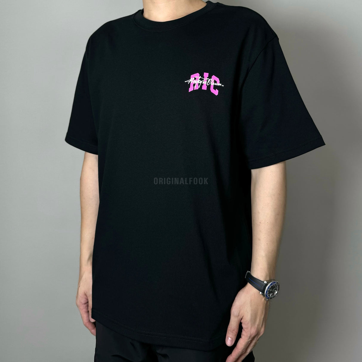 Black Rickyisclown embossed pop art T-shirt, casual apparel with bold graphic design, size small, casual streetwear style.