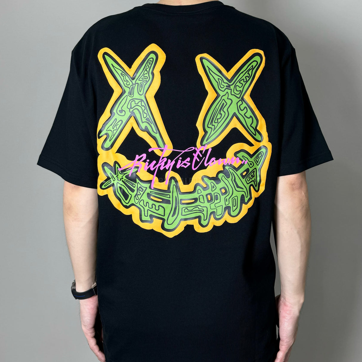 Rickyisclown black pop art embossed T-shirt featuring bold graphic design and crew neck from the Rickyisclown apparel collection.