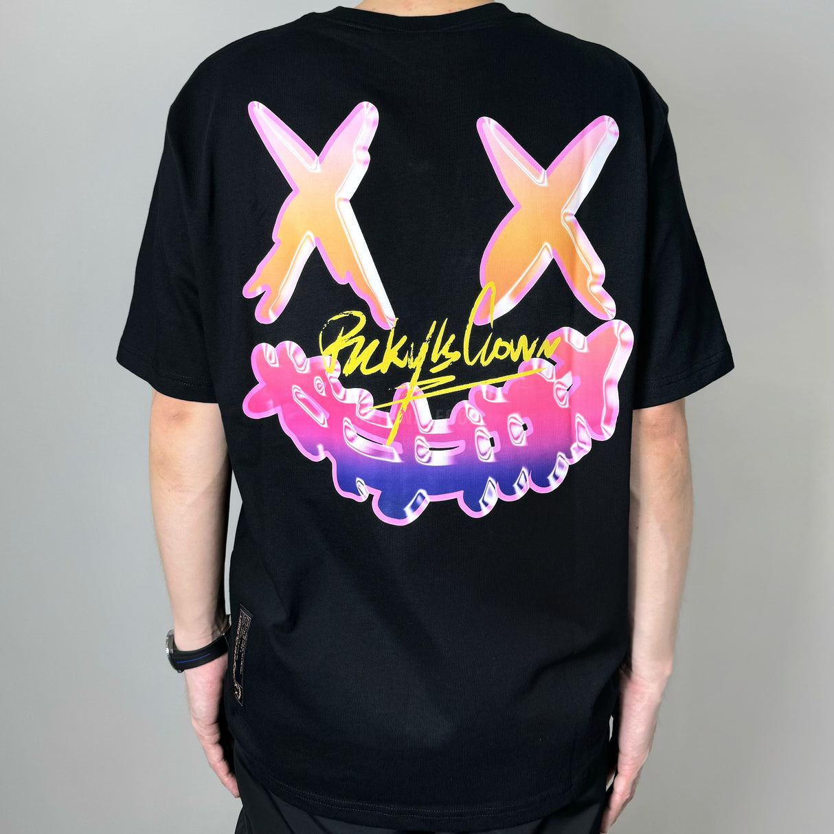Black Rickyisclown neon party tee featuring vibrant neon graphics, casual fit, and RICKYISCLOWN branding.