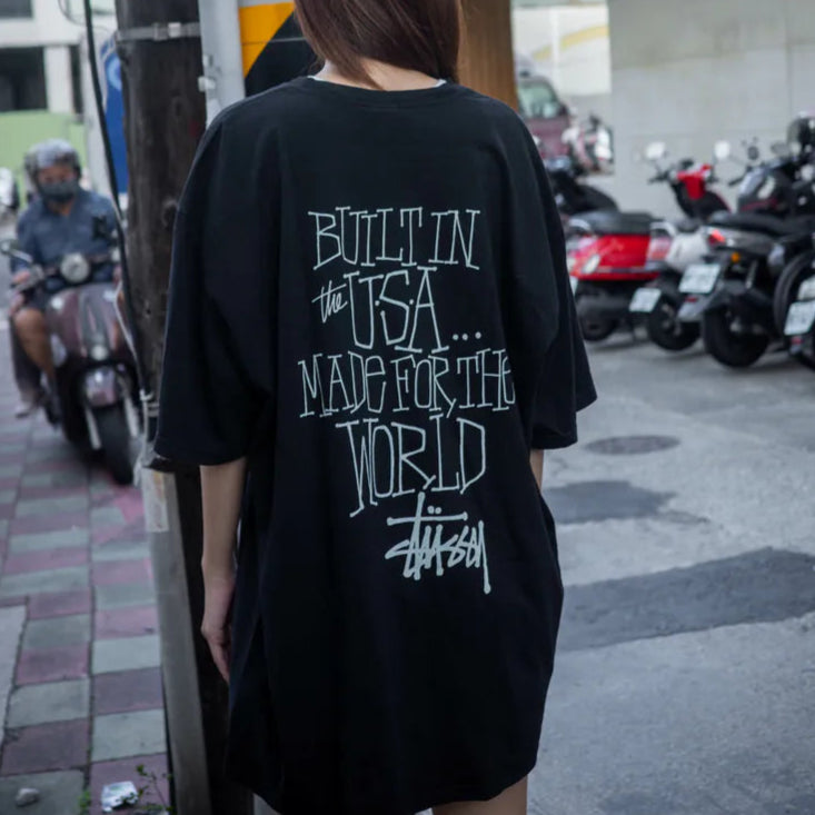 Black Stussy Built In America Tee shirt with front graphic design, casual apparel made by STUSSY.