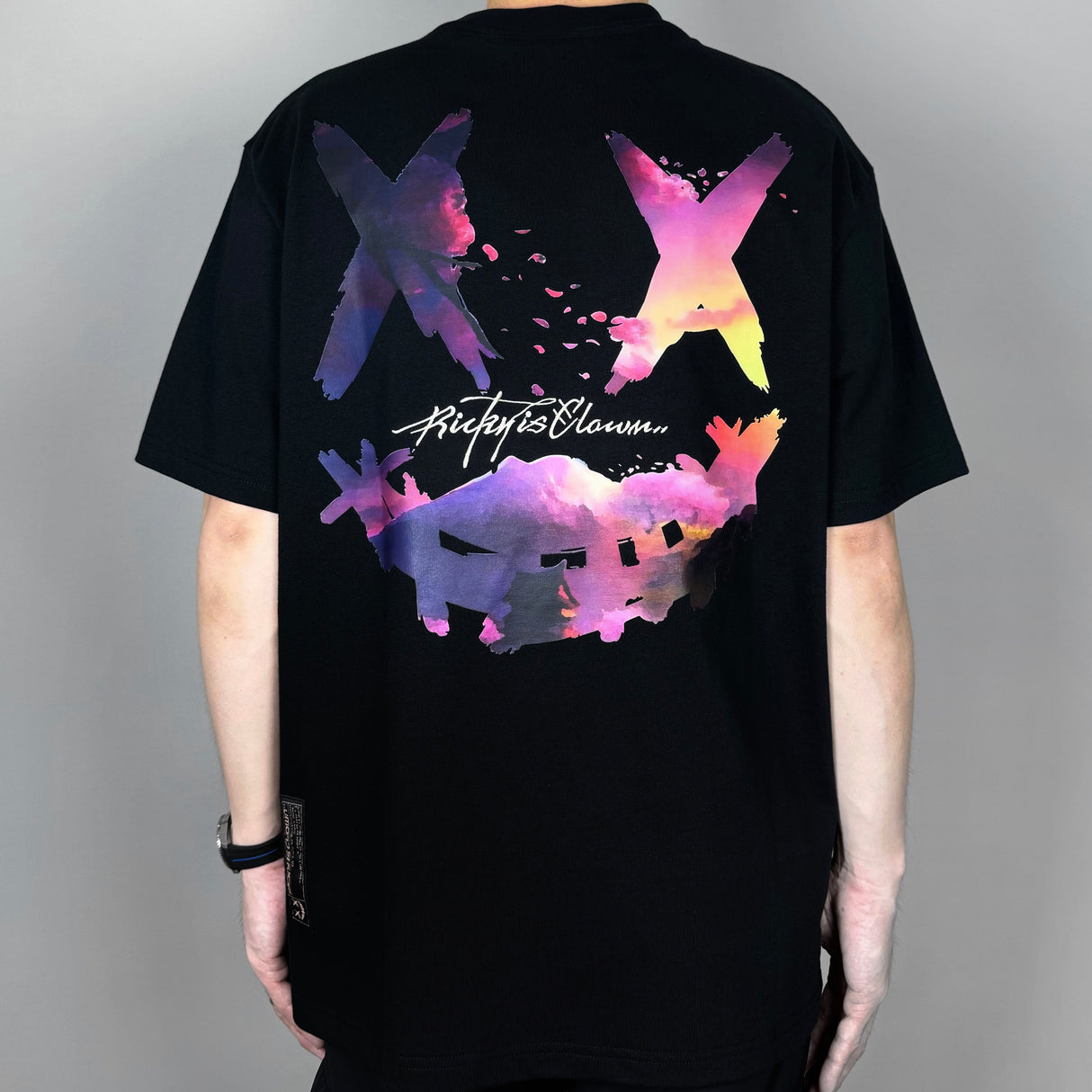 Black Rickyisclown Sakura Sunset Tee featuring a vibrant sunset graphic and casual fit, from the Rickyisclown apparel collection.