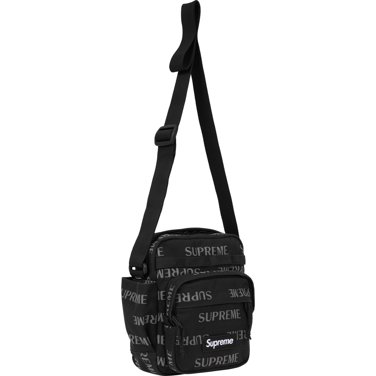 Supreme black reflective shoulder bag with silver monogram logo, featuring a sleek design and adjustable strap.