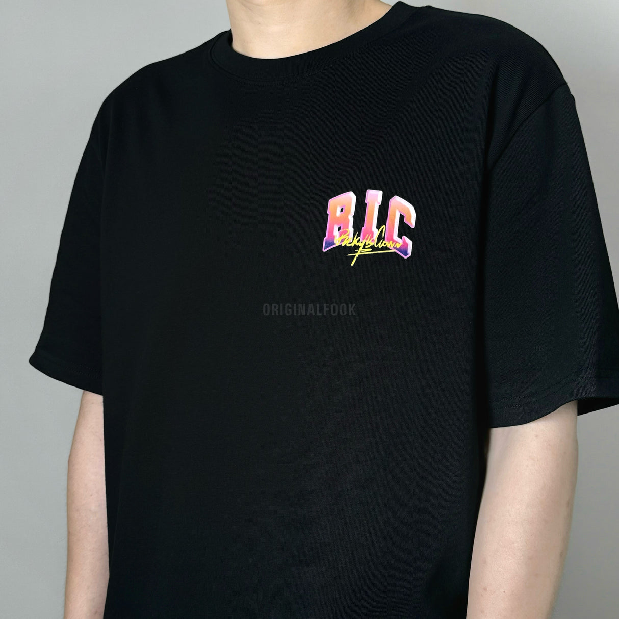 Black Rickyisclown Neon Party Tee featuring bold neon graphics, casual fit, and RICKYISCLOWN branding on the front.
