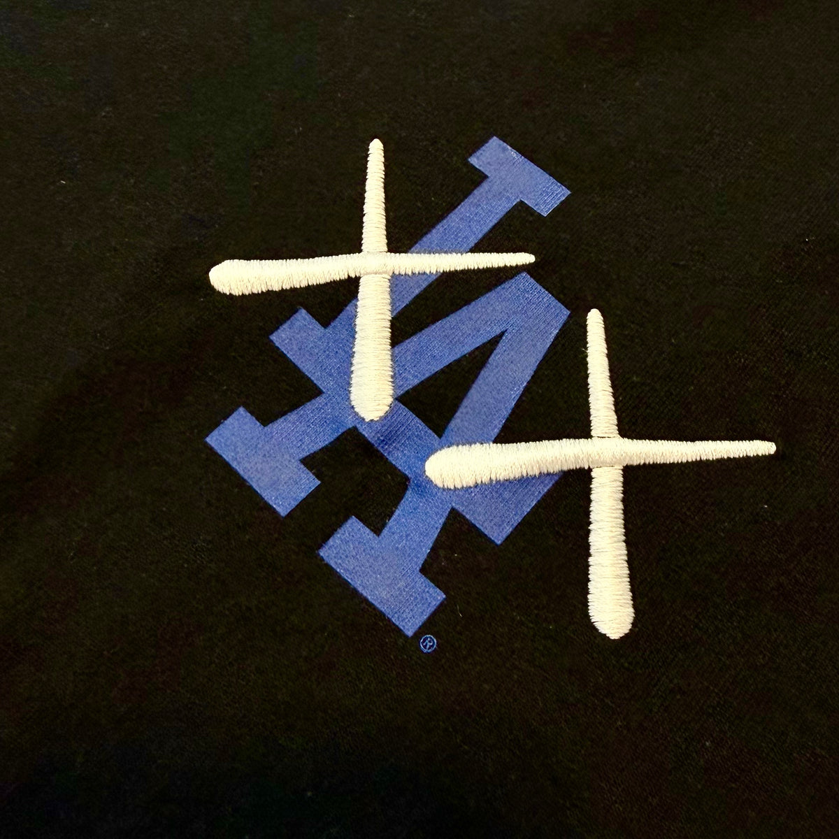 Black KAWS X Nike Los Angeles Dodgers MLB Elevated Max 90 Tee, men's apparel with graphic design, by HUMAN MADE.