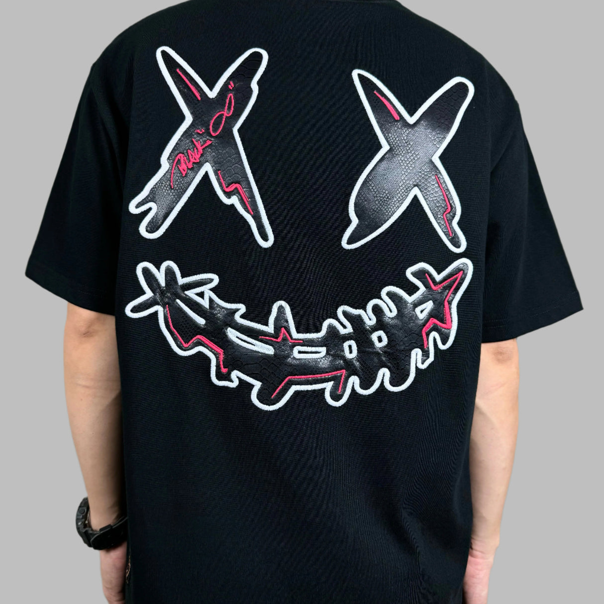 Black Rickyisclown Big Embossed Snake T-shirt featuring a bold snake design on the front, casual apparel from Rickyisclown.