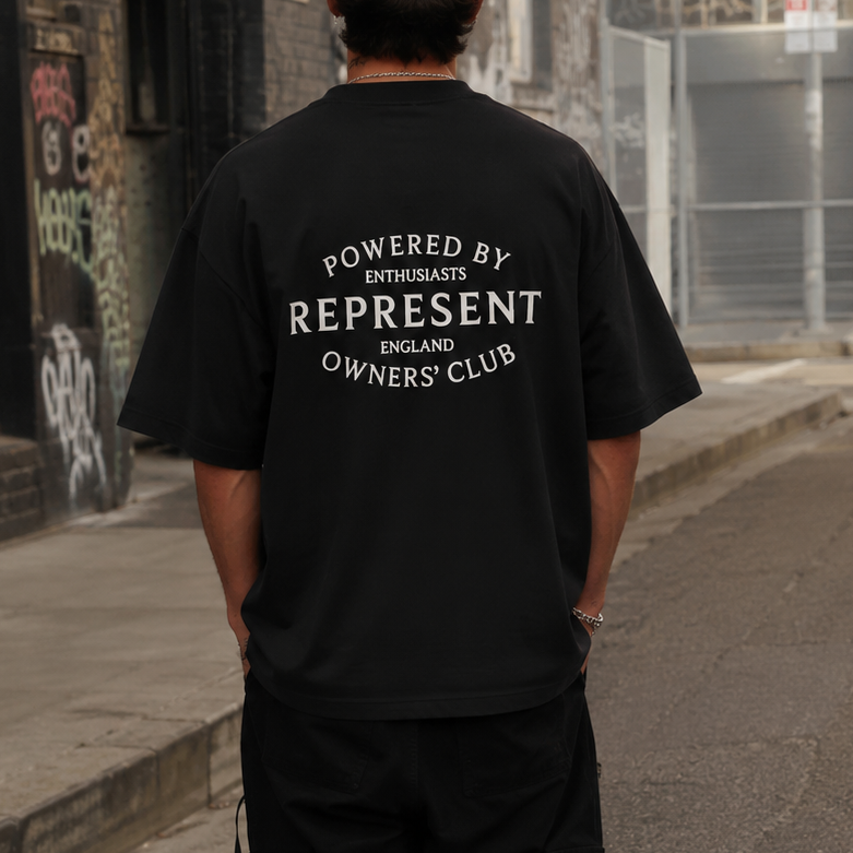 Black Represent Stamp Logo Tee shirt with a bold logo print on the front, made from soft cotton fabric.