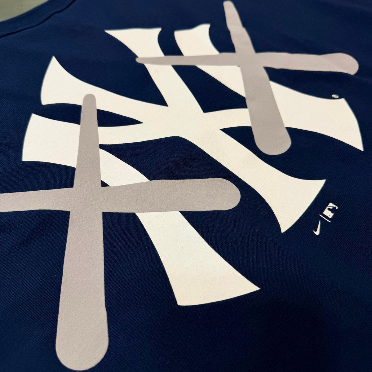 Human Made KAWS X Nike MLB Elevated Max 90 Navy tee for men, featuring graphic design and casual fit in a navy color.