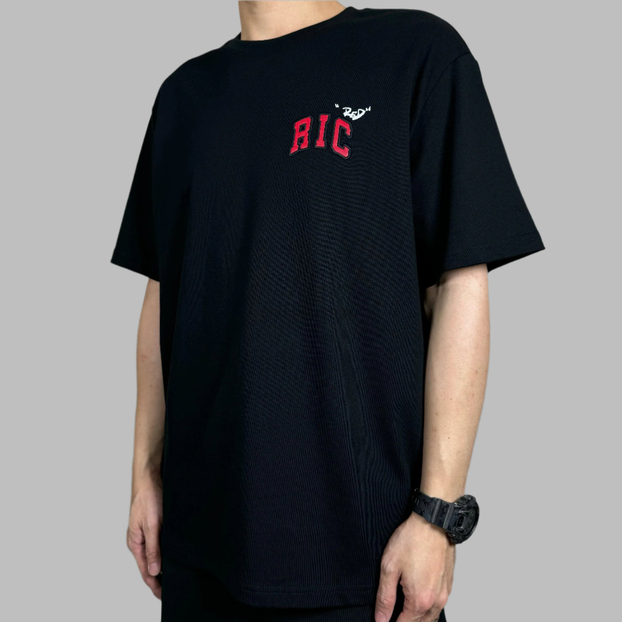 Black Rickyisclown Snake Embossed Chest Tee featuring snake design on the front, casual apparel by RICKYISCLOWN.