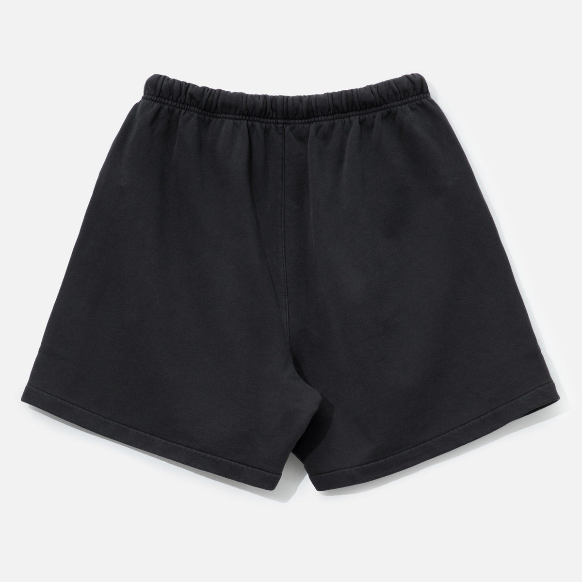 Fear of God Essentials Training 90s Shorts in faded black, casual athletic shorts with a relaxed fit and brand logo detail.