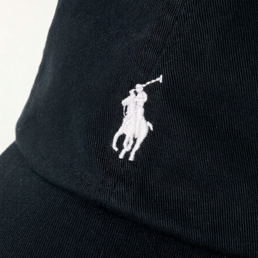 Black Polo Ralph Lauren baseball cap with embroidered logo, made of cotton twill, featuring a classic headwear design.