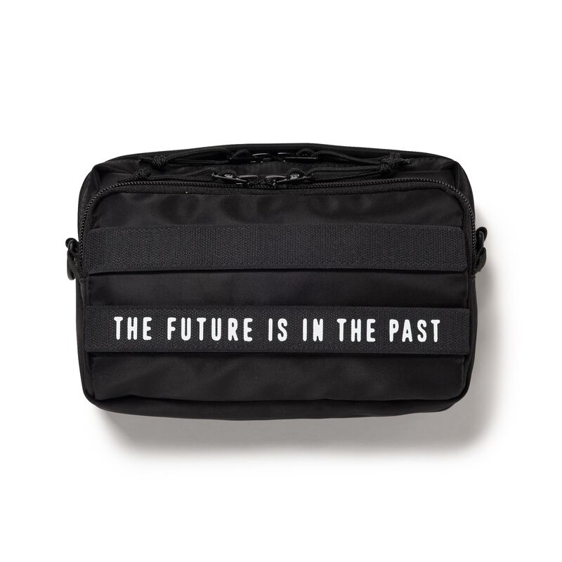 Black Human Made military sling bag with adjustable strap and multiple compartments for versatile carrying.