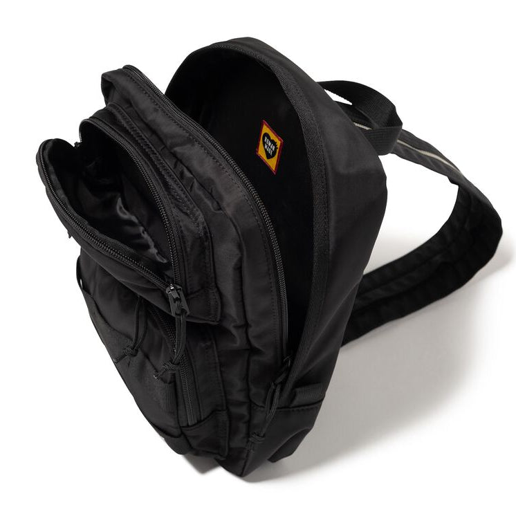 Human Made black one-shoulder bag with sleek design and adjustable strap, made of durable material, perfect for casual use.
