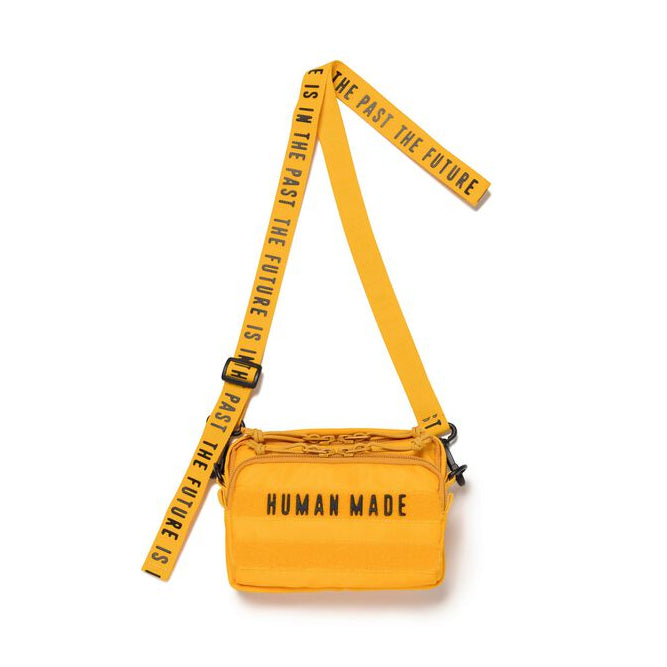 Yellow Human Made Military Mini Sling Bag with adjustable strap and compact design, perfect for casual wear and everyday use.