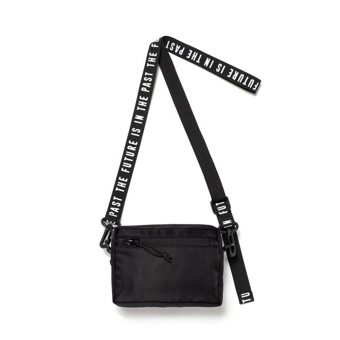 Black Human Made Military Mini Sling Bag with adjustable strap and compact design, ideal for carrying essentials.