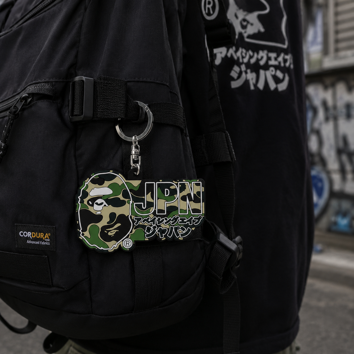 Bathing Ape Camo Japan Rubber Keychain featuring BATHING APE logo and colorful camouflage design.