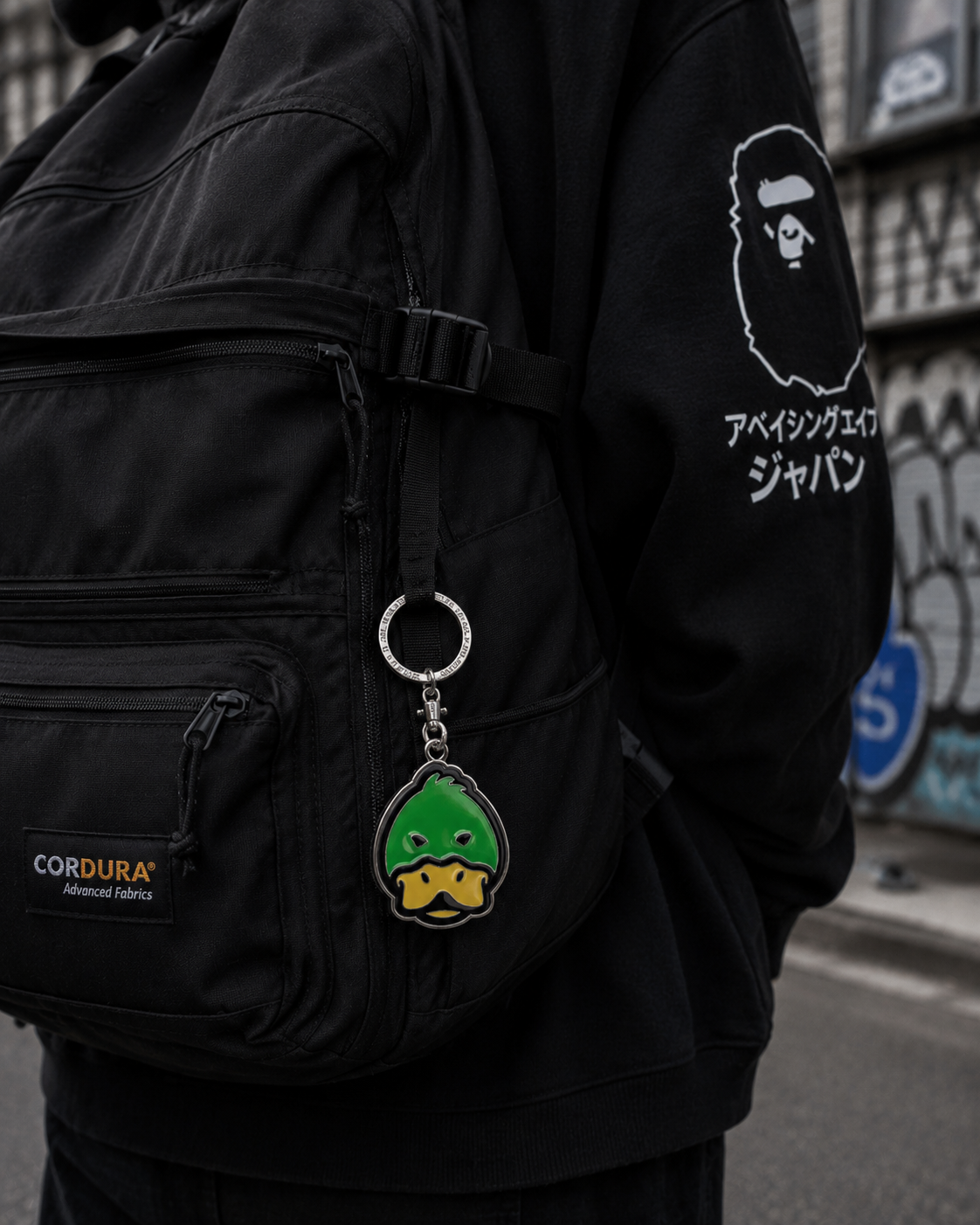 Human Made duck head keychain attached to a bag, featuring a detailed human-made duck head design in vibrant colors.