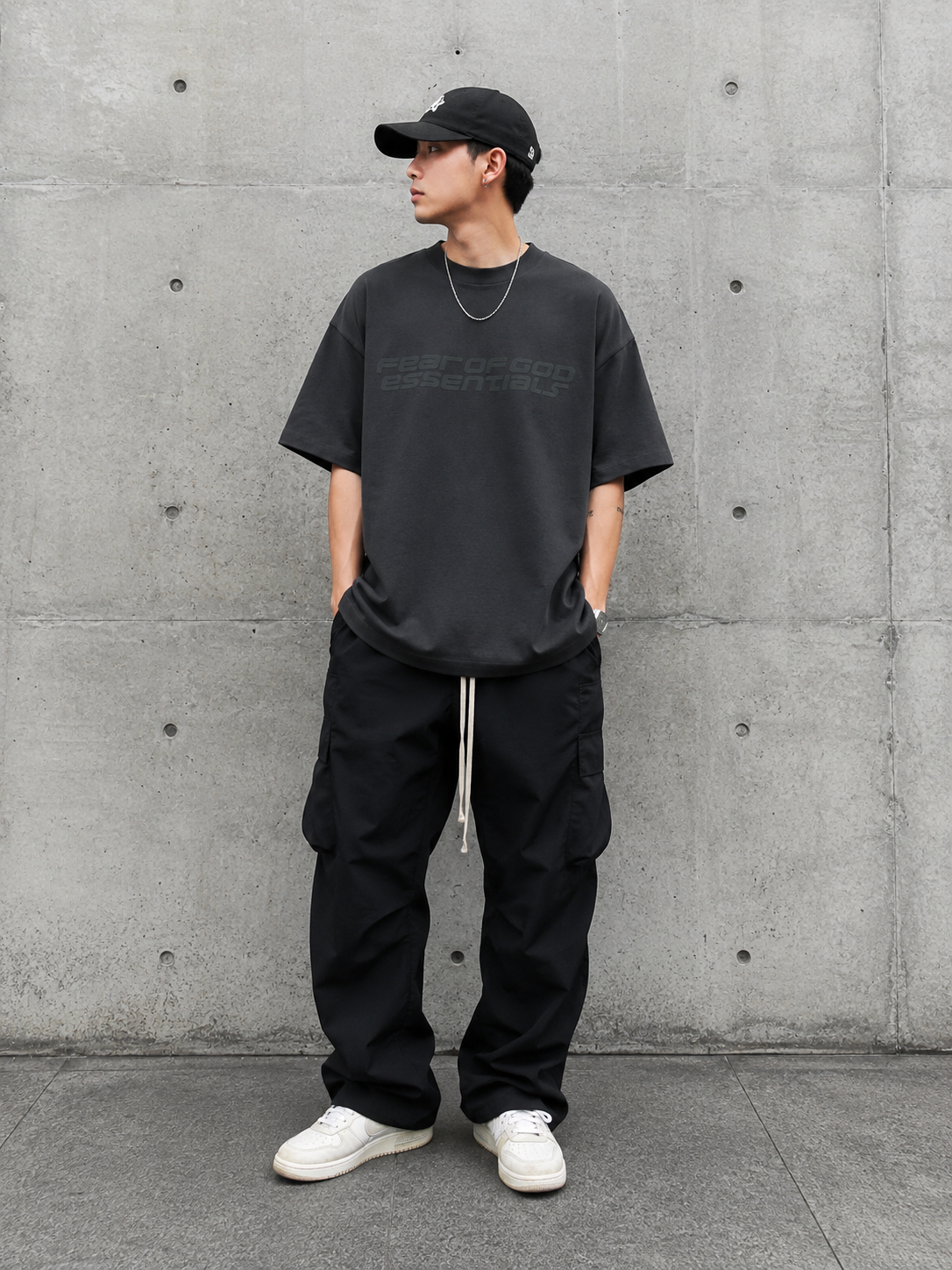Fear of God Essentials reflective logo ponte 90s tee in upgraded fabric, featuring a classic fit and bold reflective branding.